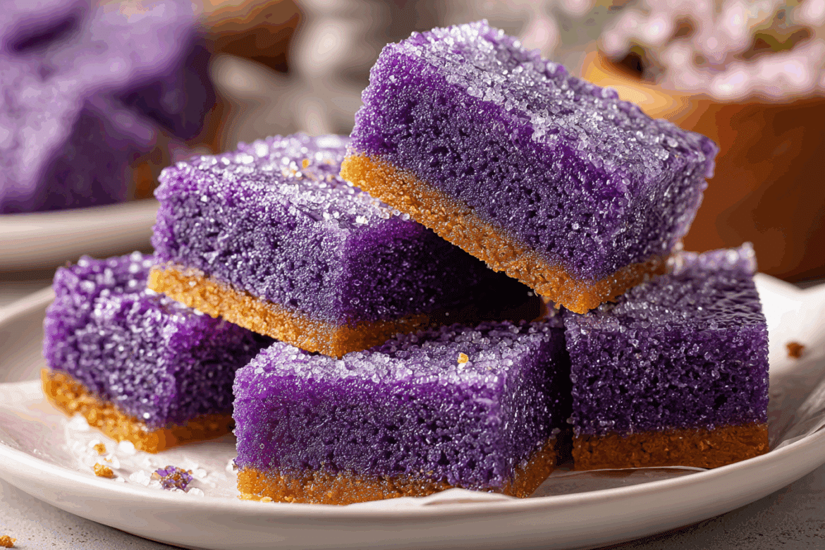 Flat lay of all the ingredients for ube bars including ube halaya, flour, eggs, butter, sugar, and more.