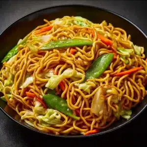 Delicious Chow Mein topped with the best Chow Mein Sauce in a vibrant bowl