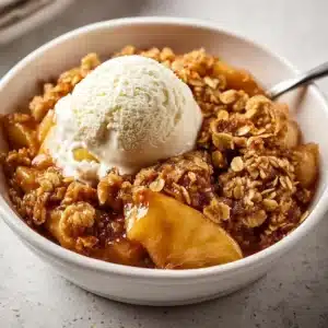 Delicious homemade apple crisp topped with crunchy oats and cinnamon
