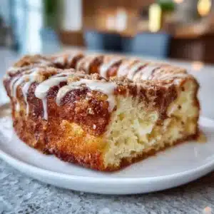 Freshly baked Cinnamon Donut Bread with a sugary glaze and cinnamon topping