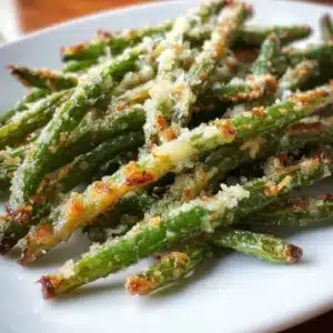Roasted parmesan green beans ready to serve on a plate