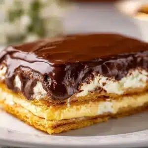 Delicious Chocolate Eclair Cake with layers of chocolate cream and eclairs