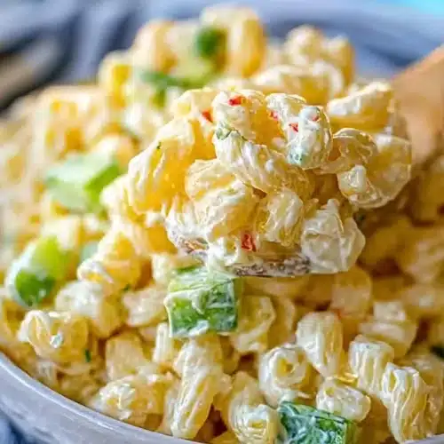 Dolly Parton's macaroni salad served in a bowl with vegetables