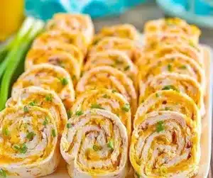 Easy Buffalo Chicken Pinwheels served on a platter with dipping sauce