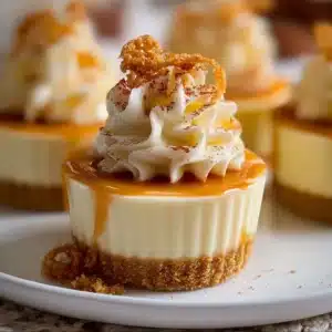 Delicious eggnog mousse cups topped with whipped cream and nutmeg.